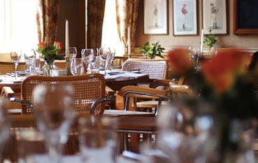 A dining table set for service at Woods
